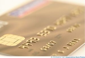 Close up of a gold credit card